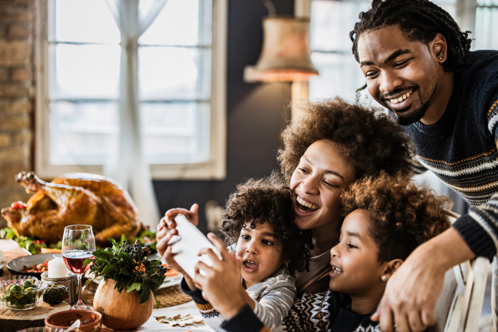 family at table on phone