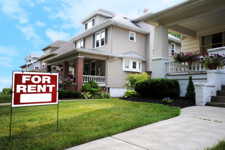 house with a for rent sign