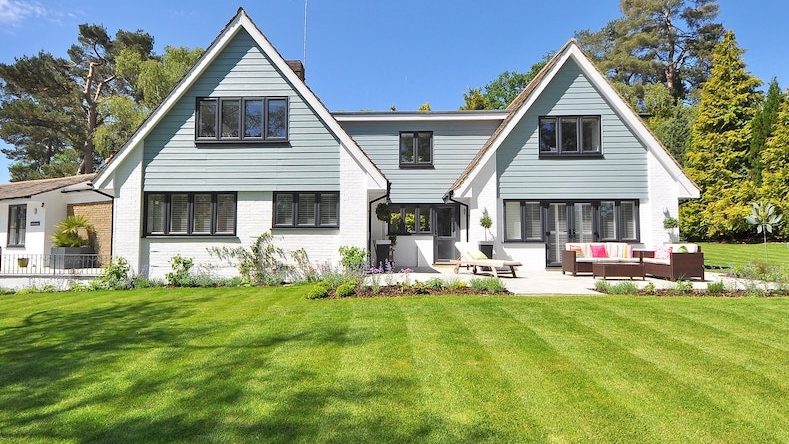 house with green grass