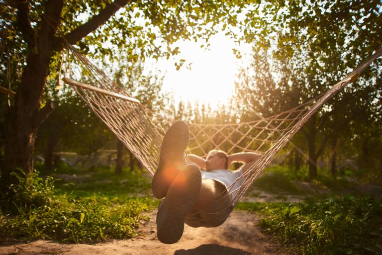 Man relaxing in a hammock