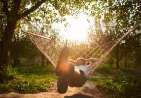 Man relaxing in a hammock